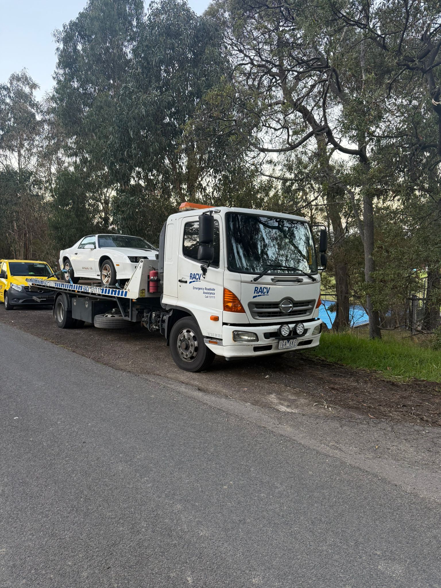 Classic Camaro IROC-Z on a recovery truck