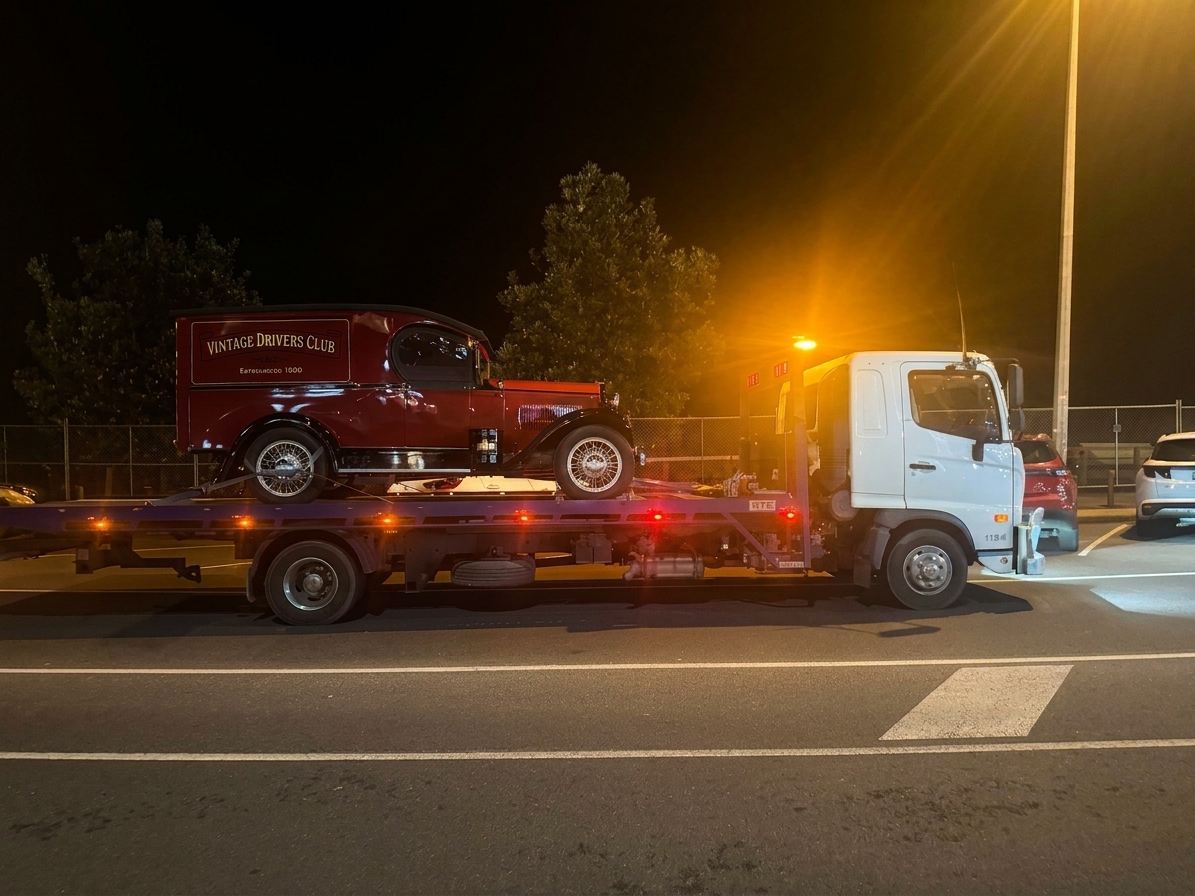 Vintage car transported at night